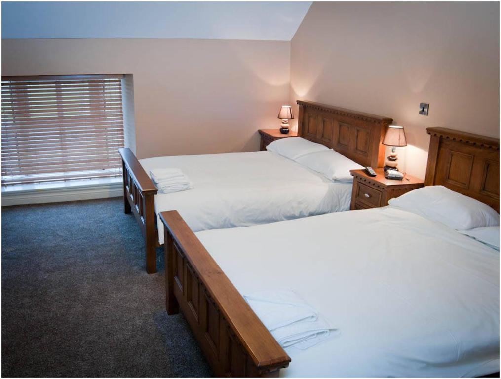 Hopper Inn Bar & Guest Accommodation Ballynaskreena Rum bild